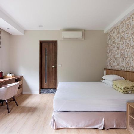 名竹旅社 Minzu Hotel لوغو المظهر الخارجي الصورة