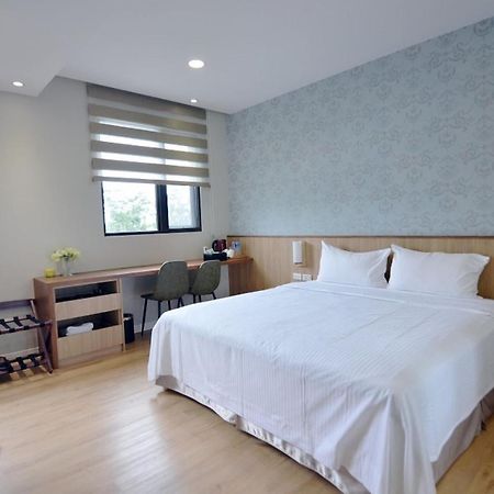 名竹旅社 Minzu Hotel لوغو المظهر الخارجي الصورة