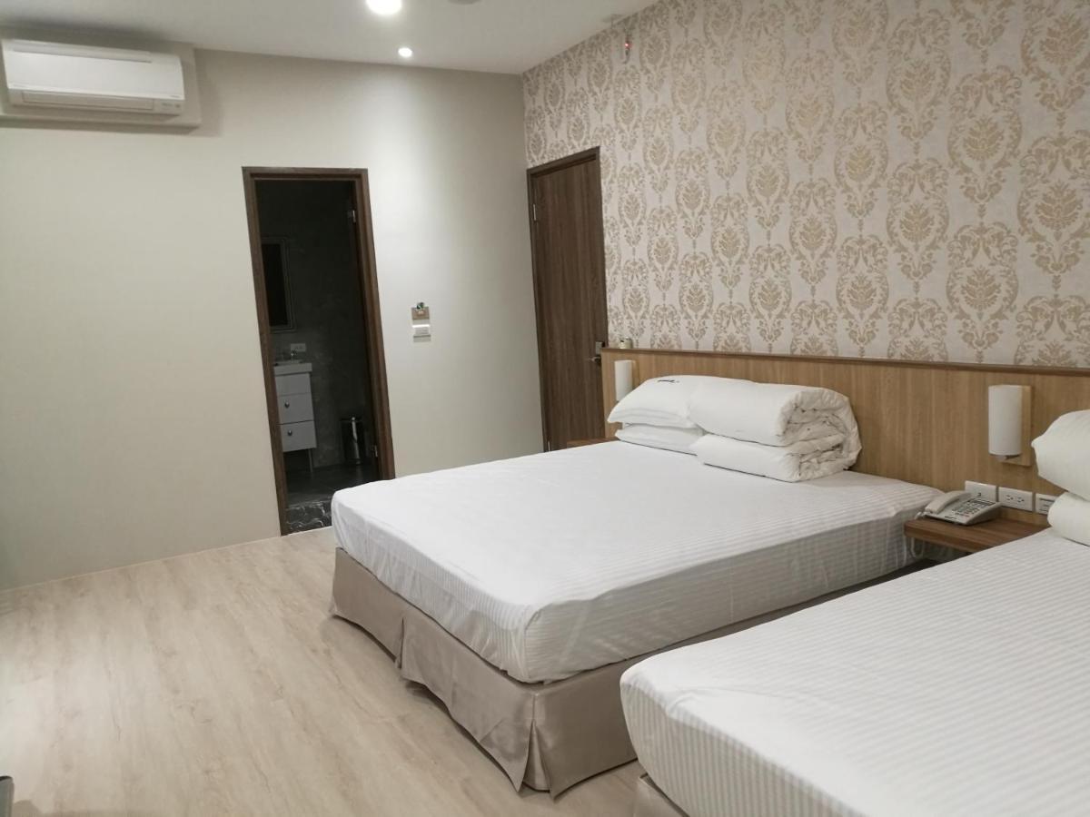 名竹旅社 Minzu Hotel لوغو المظهر الخارجي الصورة