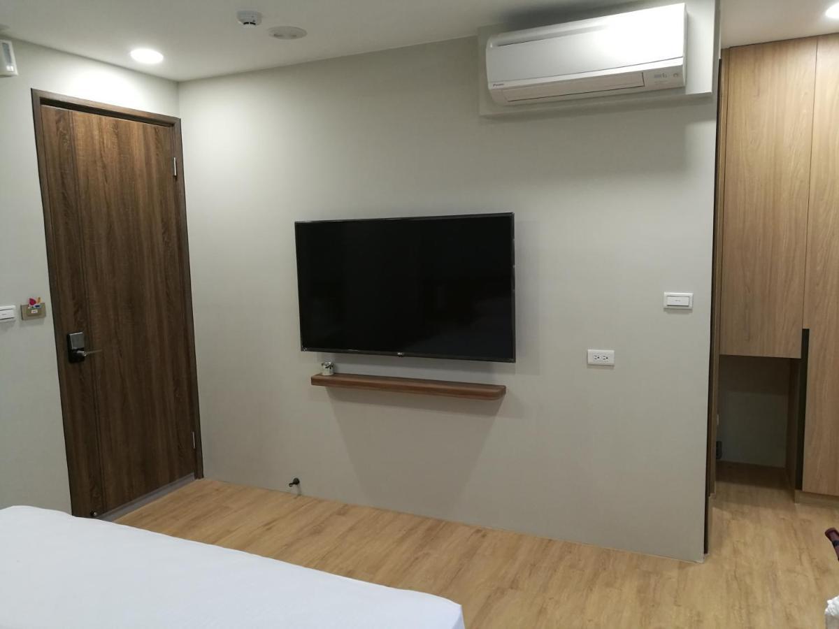 名竹旅社 Minzu Hotel لوغو المظهر الخارجي الصورة