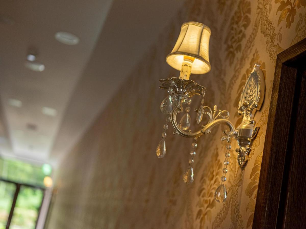 名竹旅社 Minzu Hotel لوغو المظهر الخارجي الصورة